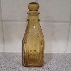 Amber Glass Bottle with Embossed Design